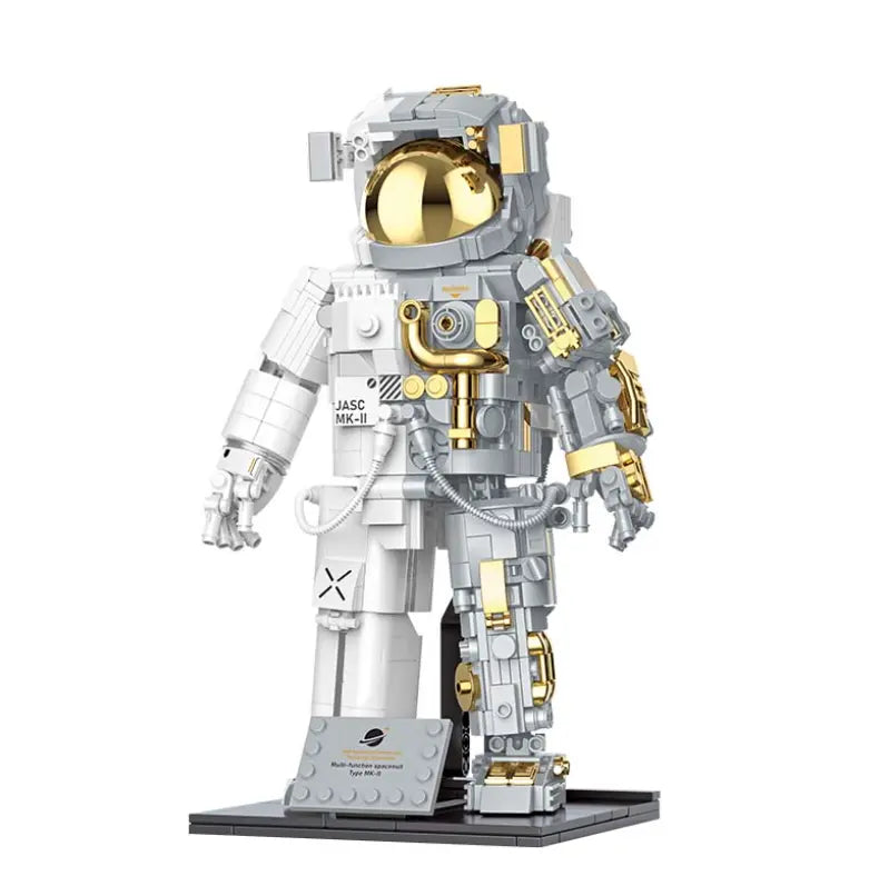 Astronaute Chrome et Or Jaki - Set de construction premium avec mécanismes internes dorés et chromés visibles.